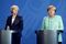 Theresa May, U.K. prime minister, left, listens as Angela Merkel, Germany's chancellor, speaks during a news conference at the Chancellery in Berlin, Germany, on Wednesday, July 20, 2016. Merkel, who hosted May in Berlin on Wednesday during her first overseas trip as prime minister, said that EU rules stipulate a country must invoke Article 50 to start the process of leaving the 28-nation bloc. Photographer: Jasper Juinen/Bloomberg