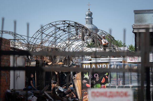 Local services clean up the city after massive shellings in Chernihiv, Ukraine, on Monday, July 4, 2022.