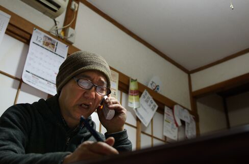 Takano speaks on the telephone in Saitama