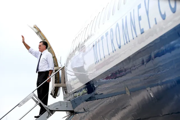 Republican presidential candidate Mitt Romney waves from his campaign plane after a rally at Avion Jet Center in Sanford, Fla., on Nov. 5