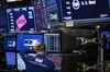 NEW YORK, NY - MARCH 22: A trader works at his desk on the floor of the New York Stock Exchange (NYSE) ahead of the closing bell, March 22, 2018 in New York City. The Dow Jones industrial average closed down more than 700 points on Thursday afternoon. Markets reacted to the Trump administrationÕs announcement of approximately $50 billion worth of yearly tariffs on Chinese imports. (Photo by Drew Angerer/Getty Images)
