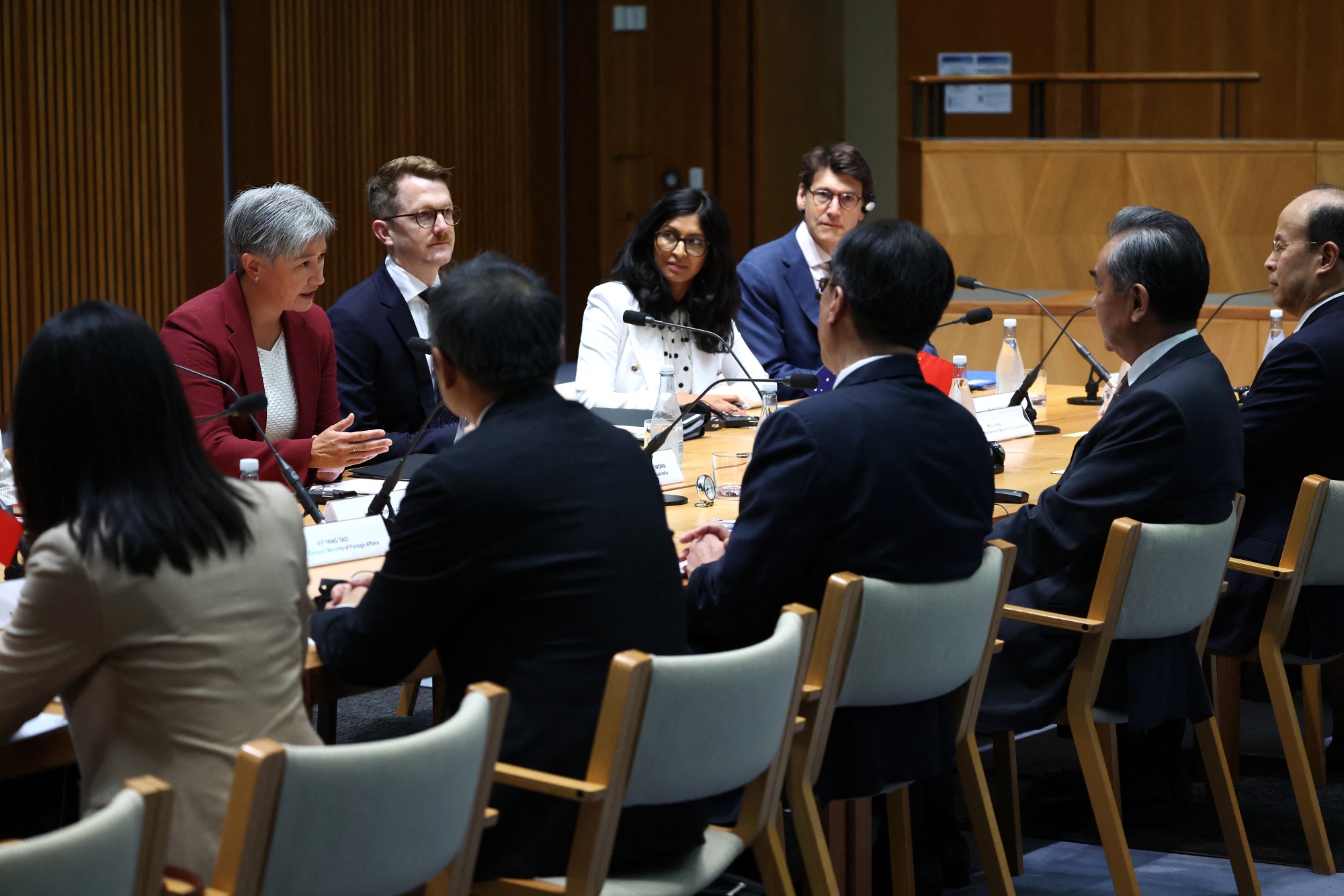 Penny Wong, left, holds talks with Wang Yi, second right, at a bilateral meeting in Canberra on March 20.