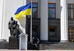 Police officers wearing face masks stand guard at the empty Ukrainian Parliament in Kiev on April 23, 2020.