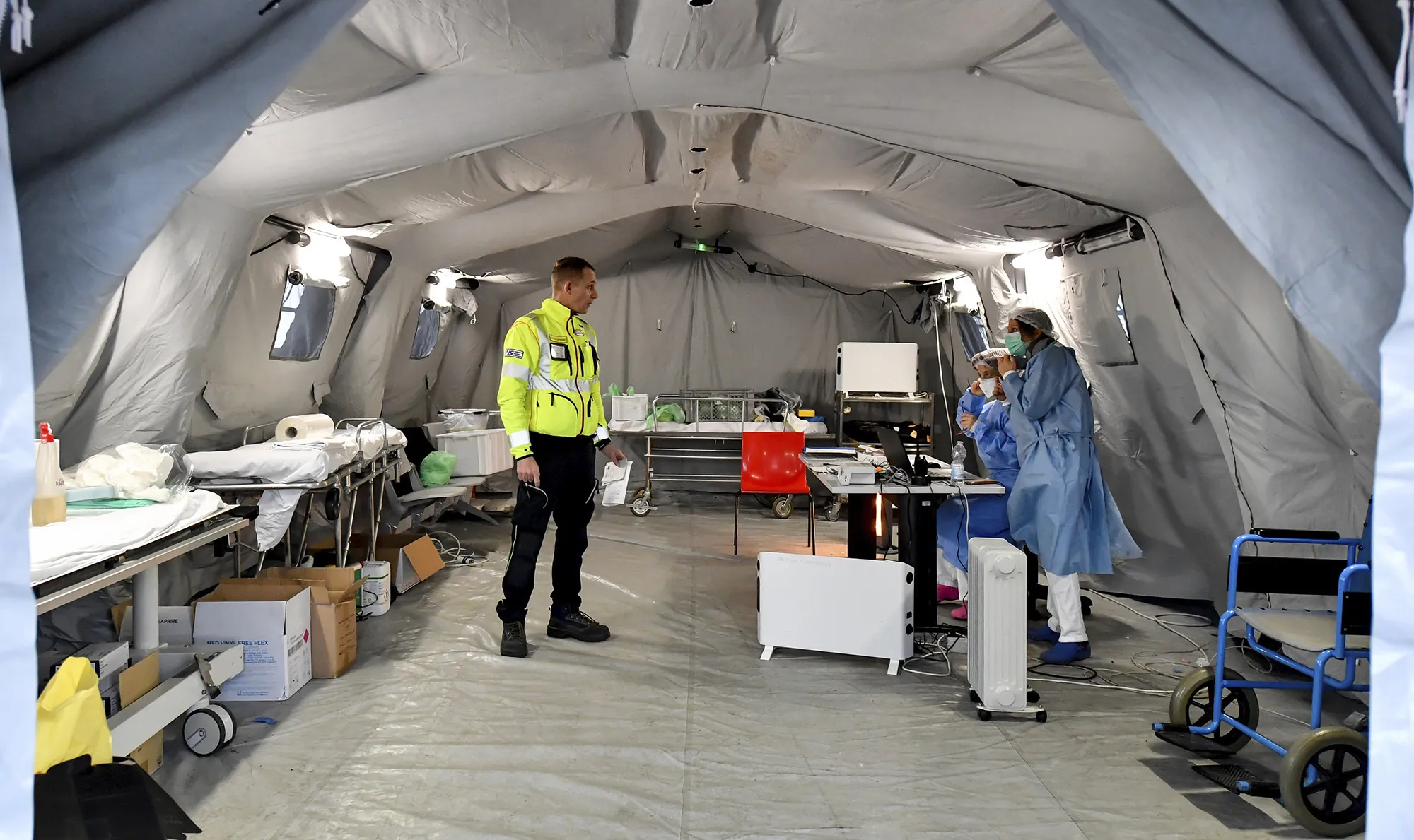 Paramedics work in a tent outside the hospital of Cremona, northern Italy on Feb. 29.