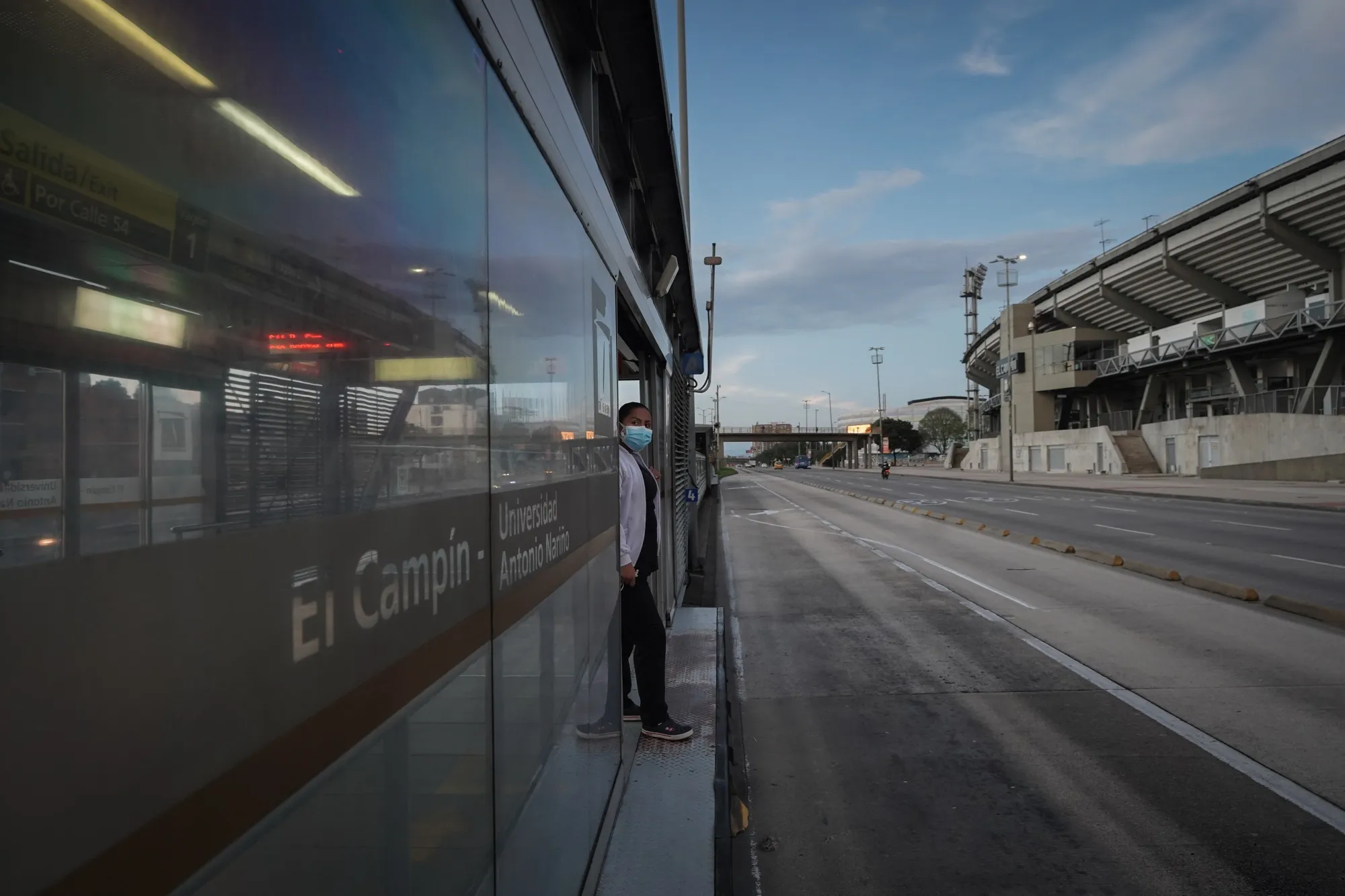 A commuter waits for a bus at a station in Bogota on April 14.