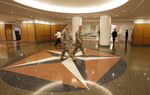 People walk through a corridor at the Pentagon in Arlington, Virginia.
