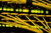 Fiber optic cables feed into a switch inside a communications room at an office in London, U.K., on Monday, May 21, 2018. The Department of Culture, Media and Sport will work with the Home Office to publish a white paper later this year setting out legislation, according to a statement, which will also seek to force tech giants to reveal how they target abusive and illegal online material posted by users.