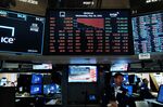Traders work on the floor of the New York Stock Exchange.