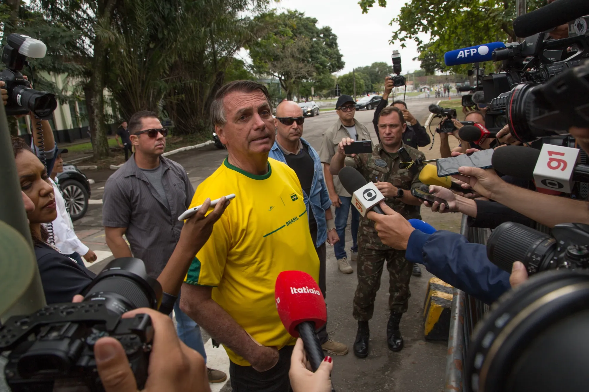 Jair Bolsonaro speaks to members of the media after casting a ballot at a polling station during the presidential elections in Rio de Janeiro, Brazil, on Oct. 2.