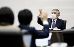 Haruhiko Kuroda, governor of the Bank of Japan (BOJ), takes a question from member of the medias during a news conference at the central bank's headquarters in Tokyo, Japan, on Friday, March 19, 2021. BOJ unveiled a set of carefully crafted policy tweaks aimed at giving itself more flexibility to keep up its long quest to revive inflation.