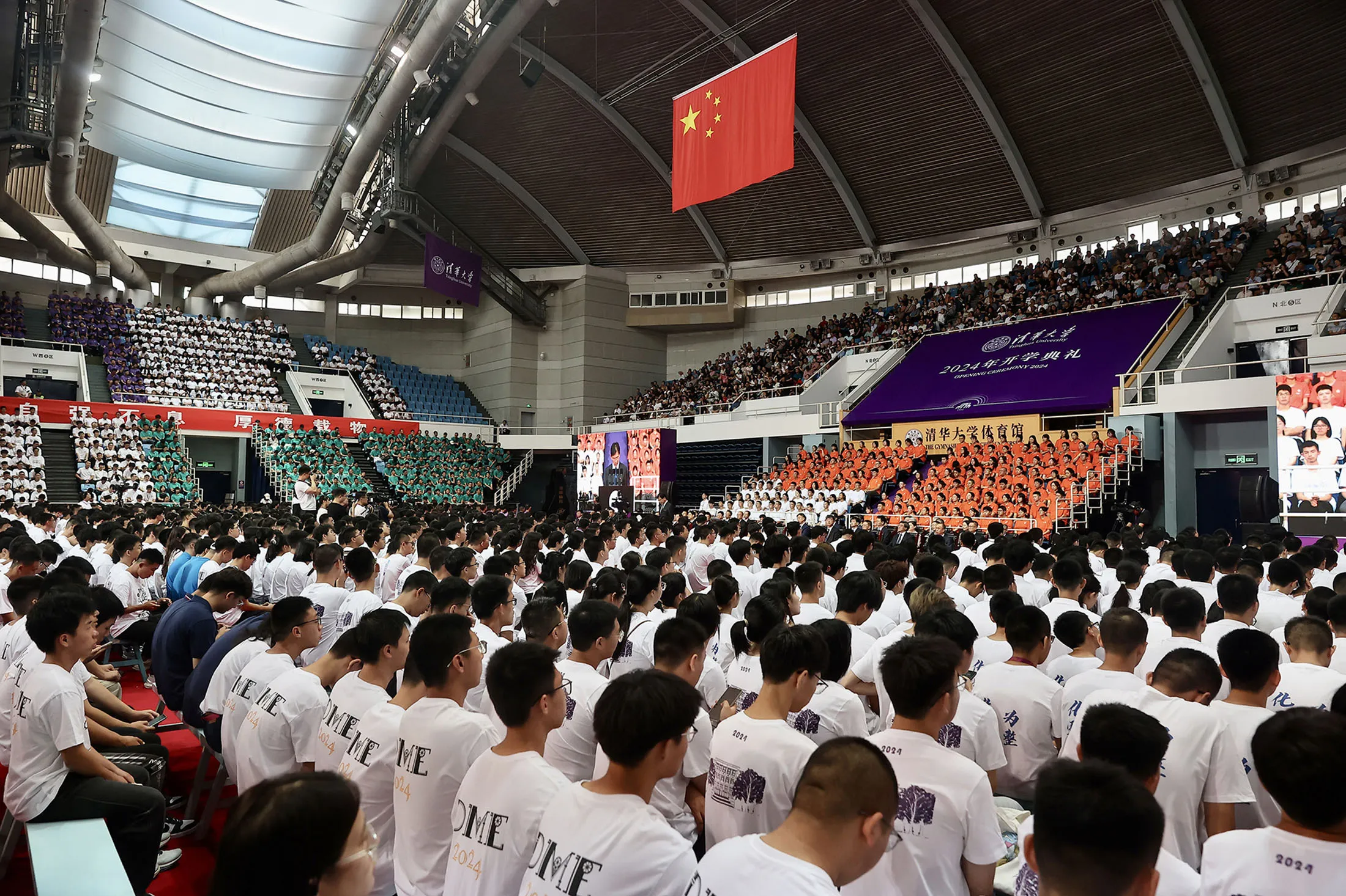 Freshmen attend the opening ceremony for undergraduate students class of 2024 in a stadium at Tsinghua University on Aug.&nbsp;15.