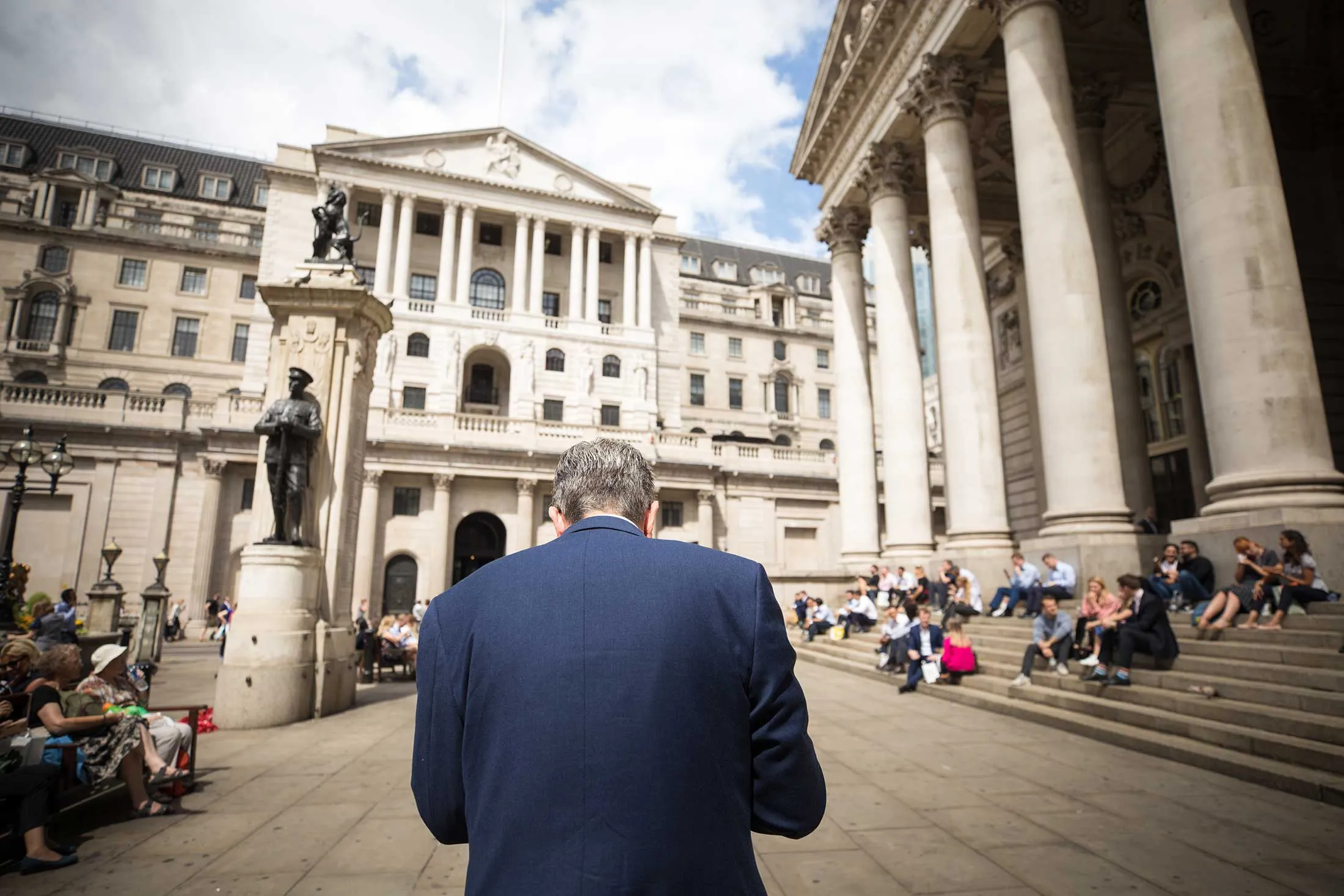 A City worker walks in view of the Bank of England in London on July 30, 2018.&nbsp;