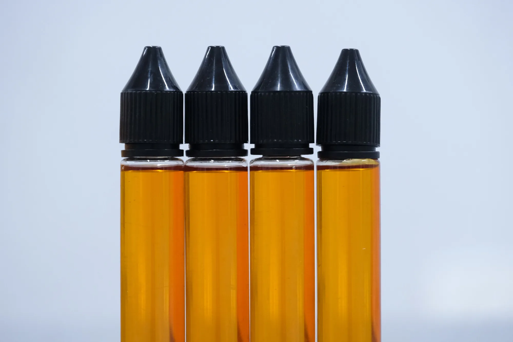 Bottles of honey flavoured vape liquid.