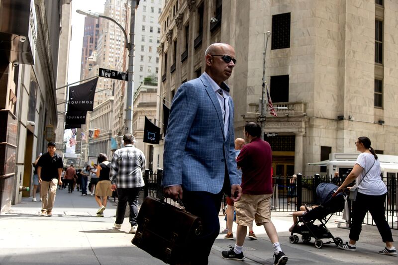 Pedestrians near the New York Stock Exchange (NYSE) in New York, US, on Wednesday, July 31, 2024.