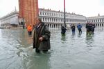 Venice Mayor Luigi Brugnaro walks on St. Mark's Square as exceptionally high tidal flooding engulfs the city.