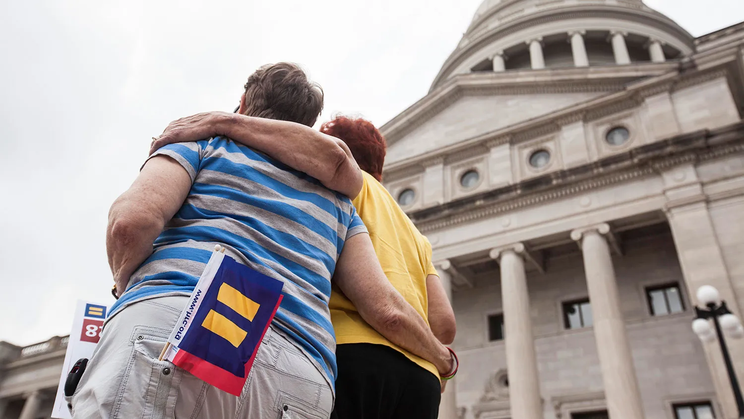 Becky Bryant (L) and her wife Wincie Gladish embrace on the steps of the Arkansas State Capital in Little Rock during a press conference by the Human Rights Campaign following Gov. Asa Hutchinson's comments on House Bill 1228, a bill passed which prohibits state and local governments from infringing on a person's religious beliefs without a 'compelling' interest, on April 1, 2015 in Little Rock, Arkansas.
