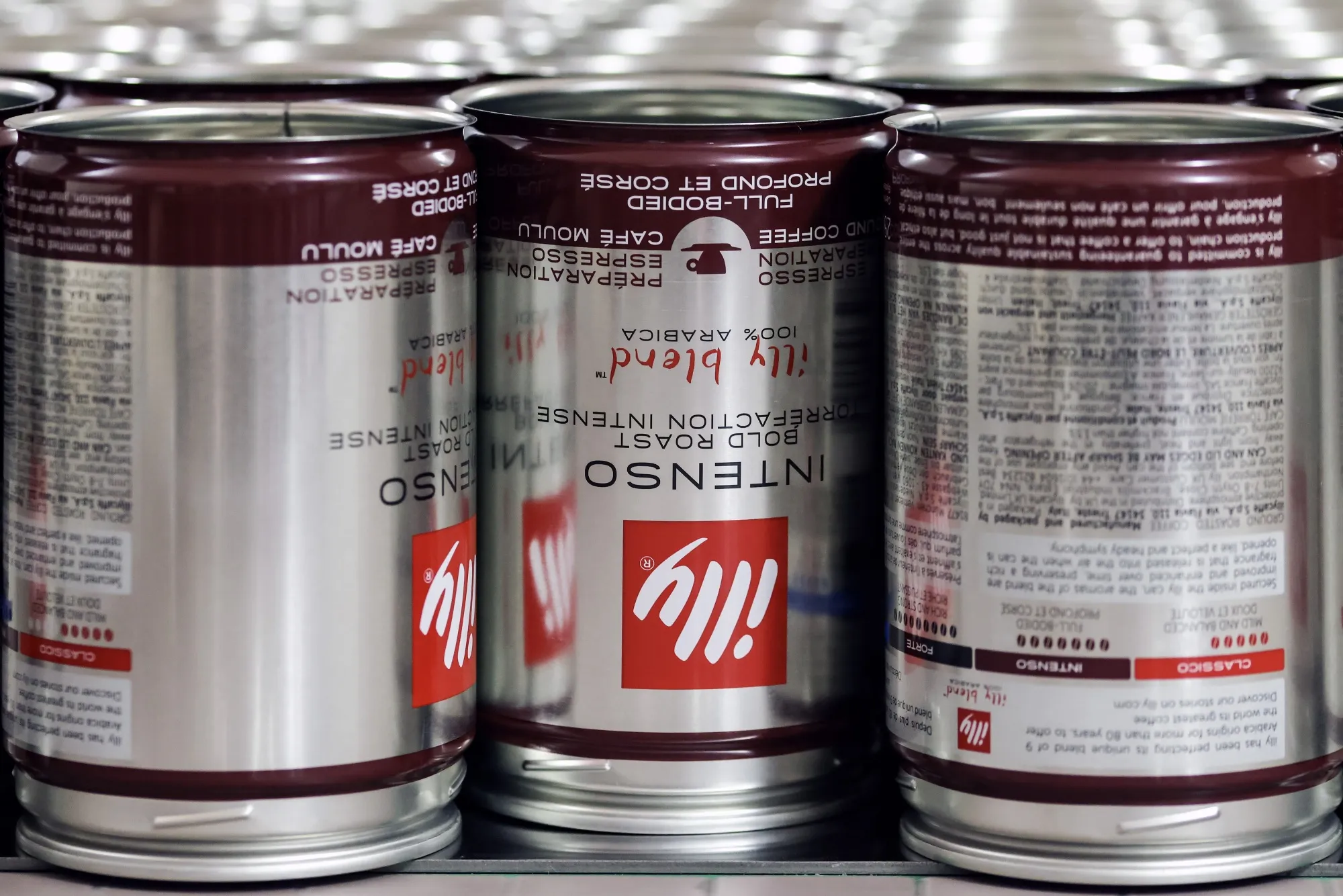 Cans of of Illycaffe blended ground coffee on the production line in Trieste, Italy.