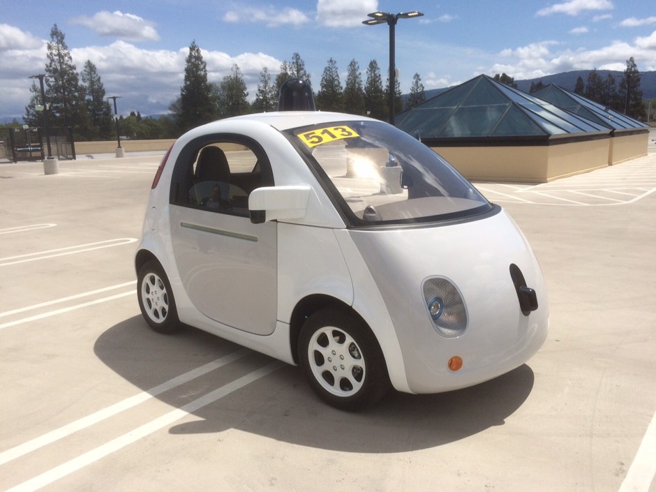 Google's latest prototype waits to give rides on the roof of the Google-X building.