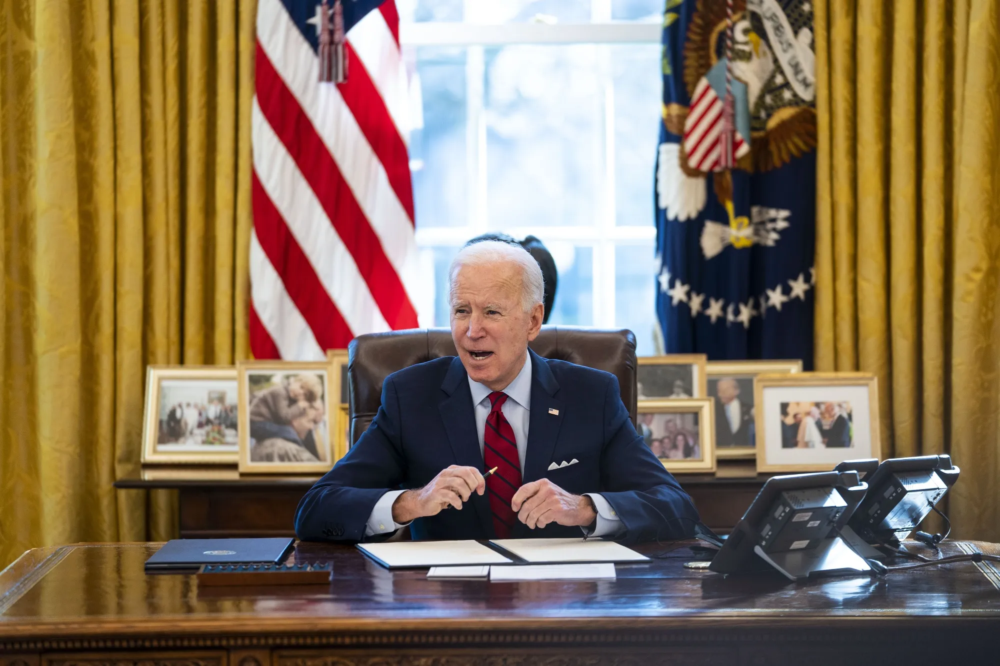 Joe Biden speaks in the Oval Office of the White House in Washington, D.C. on Jan. 28.