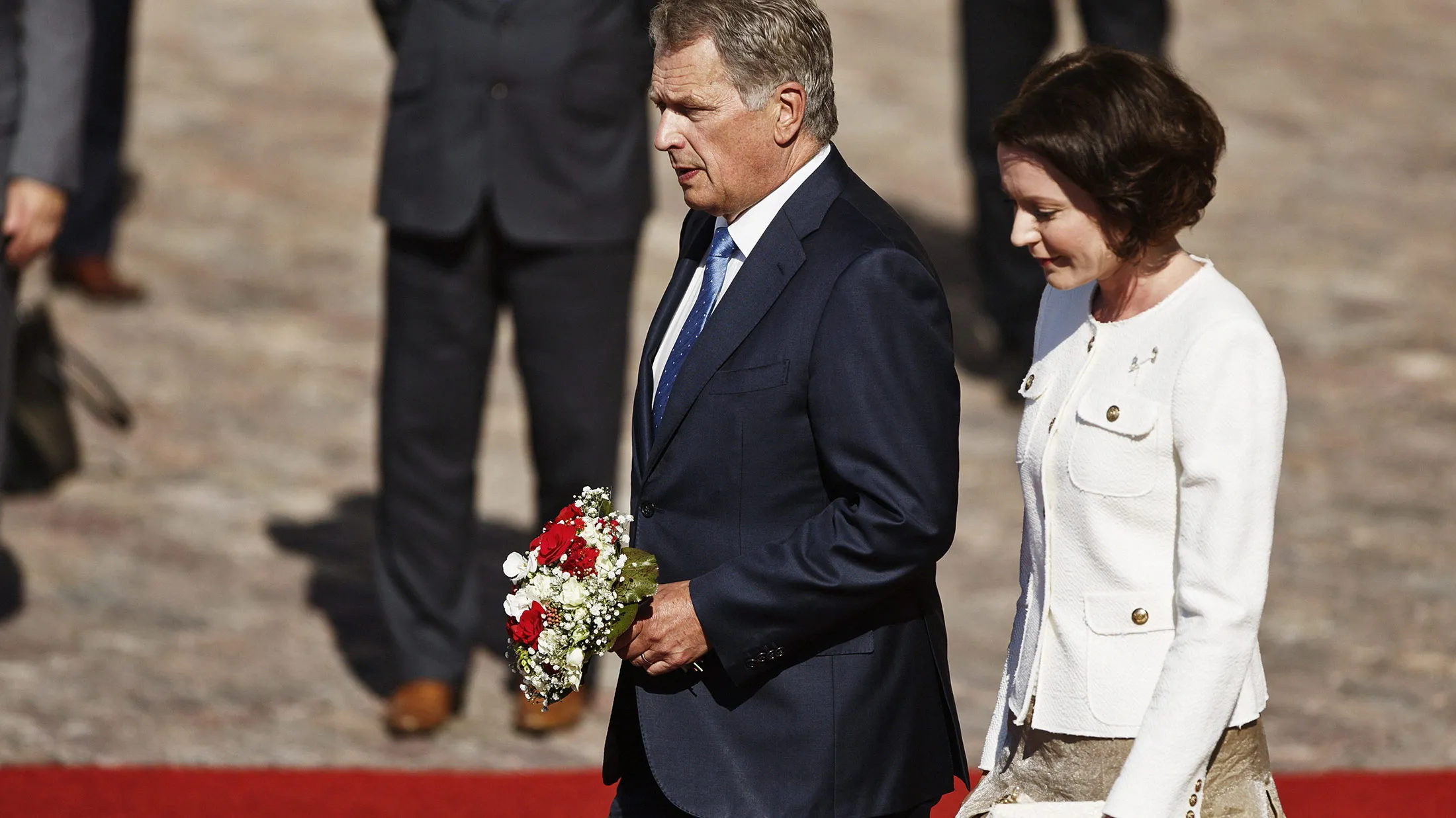 Finish President Sauli Niinisto and his wife, Jenni Haukio, take part in a ceremony to welcome Japan’s prime minister and his wife in Helsinki on July 10, 2017.
