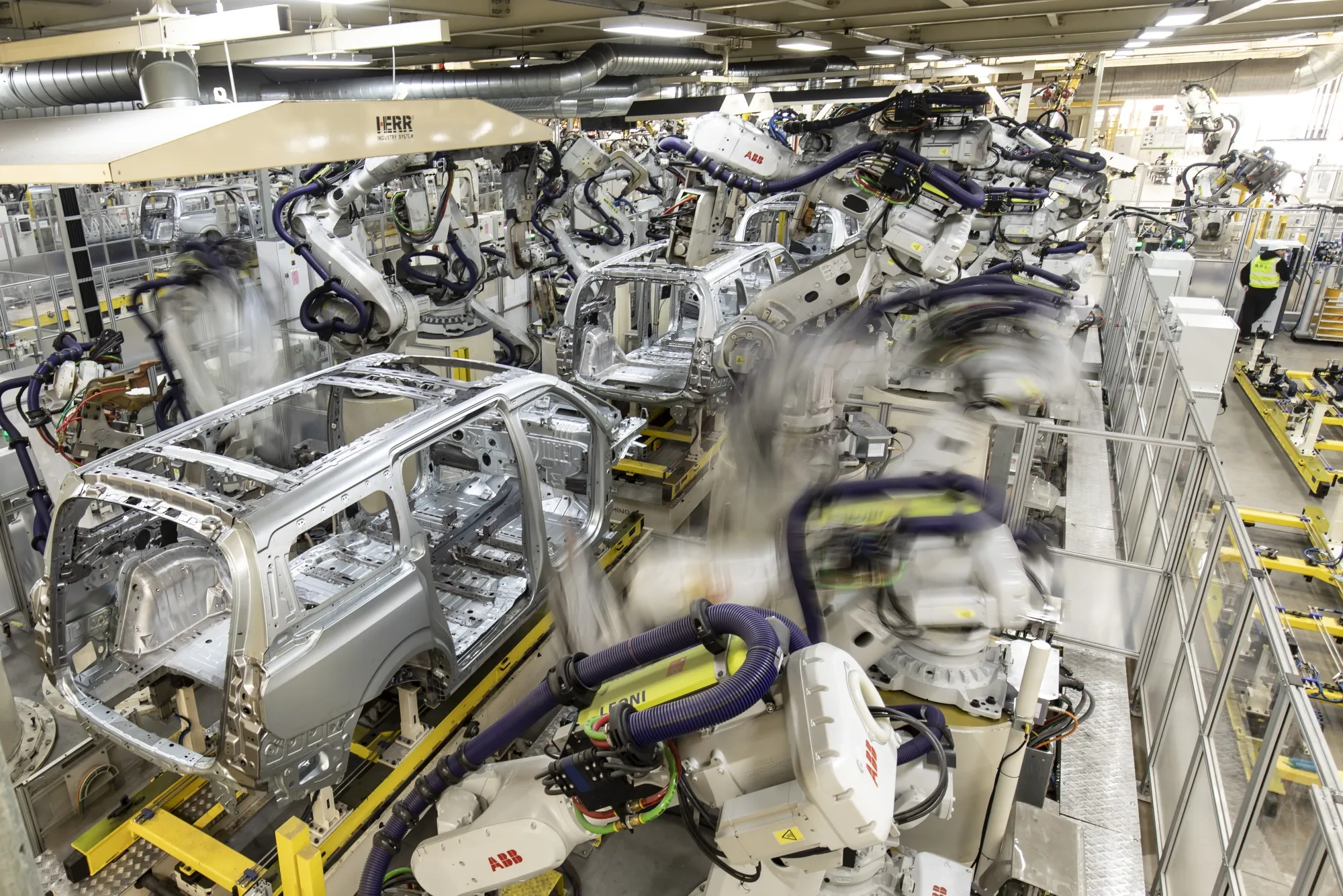Robotic arms operate on the production line of the Zeekr Co. 009 electric luxury minivan&nbsp;in Ningbo, Zhejiang Province, China.