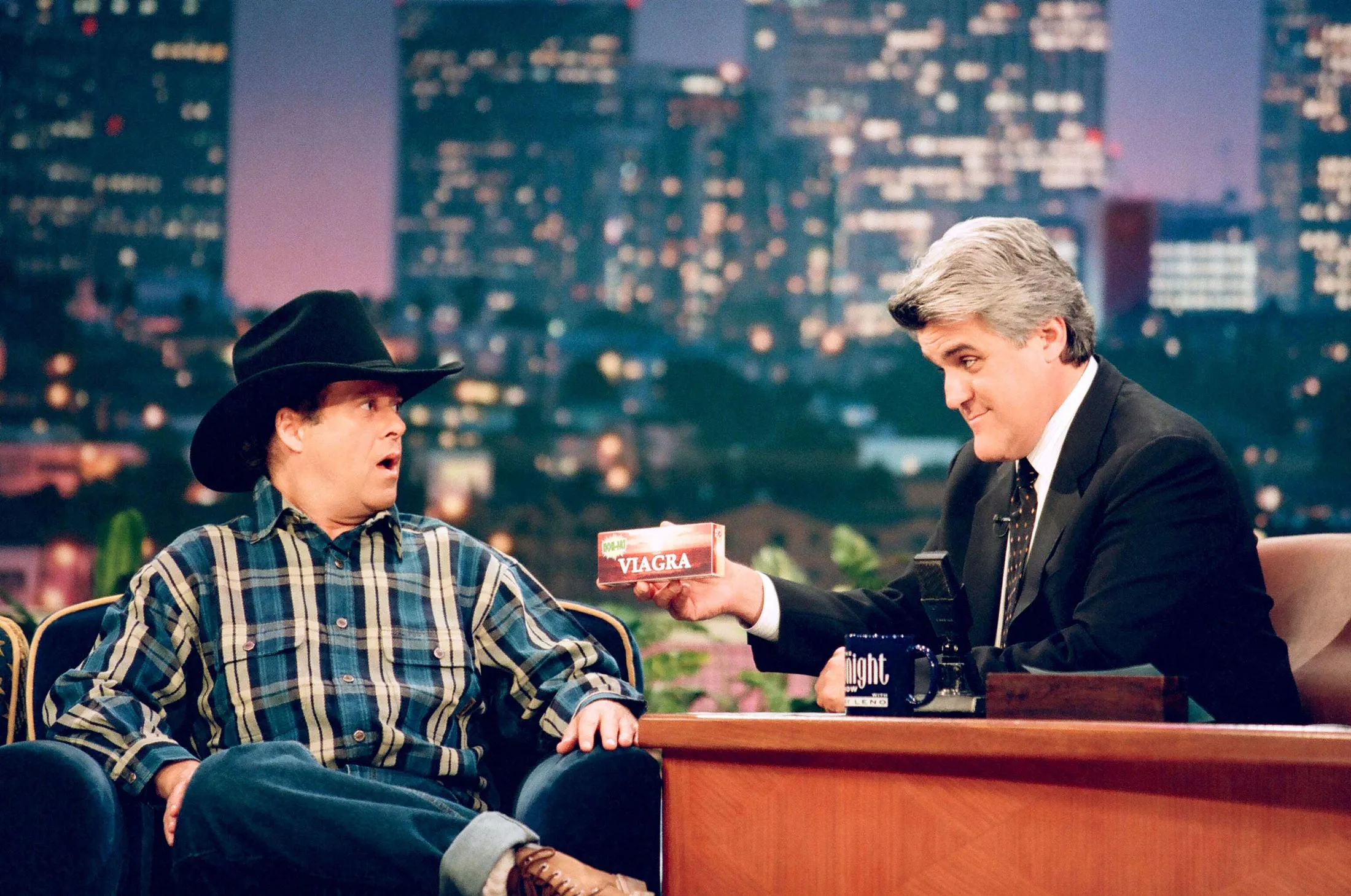 Talk show host Jay Leno (right) does&nbsp;a Viagra gag with fitness personality Richard Simmons on July 16, 1998.&nbsp;