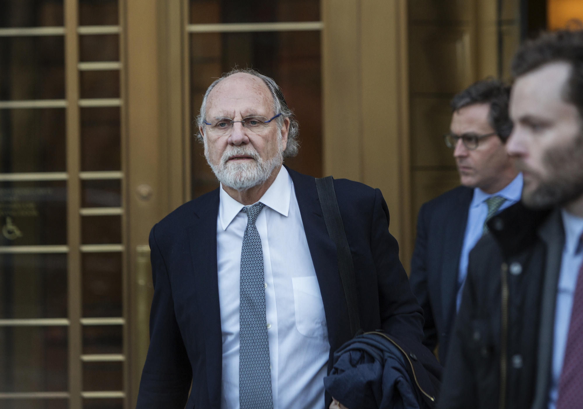 Jon Corzine exits district court in New York on March 9, 2017.