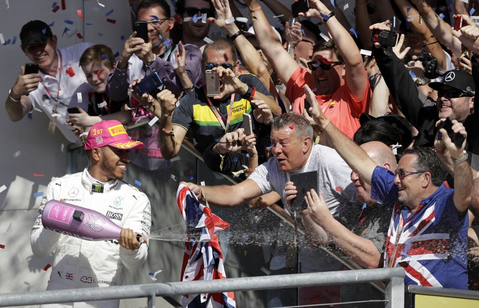 As fans cheer, Lewis Hamilton celebrates winning the U.S. Grand Prix at Austin's Circuit of the Americas in 2017.