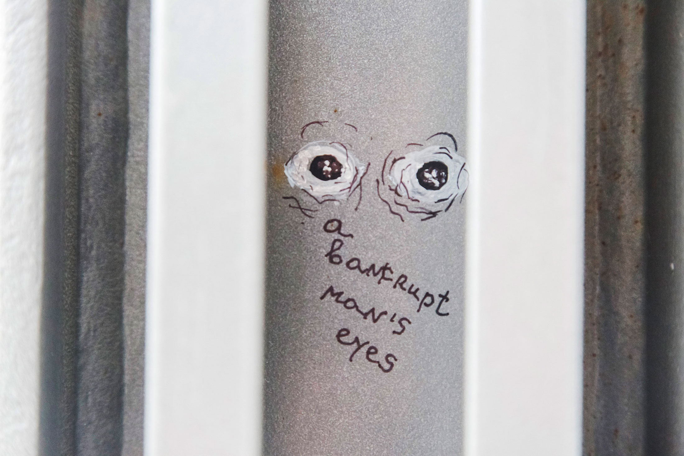 The words &quot;a bankrupt man's eyes&quot; written by artist Nedko Solakov adorn a wall in the atrium of the European Central Bank (ECB) headquarters in Frankfurt, Germany, on Wednesday, Oct. 21, 2015.

