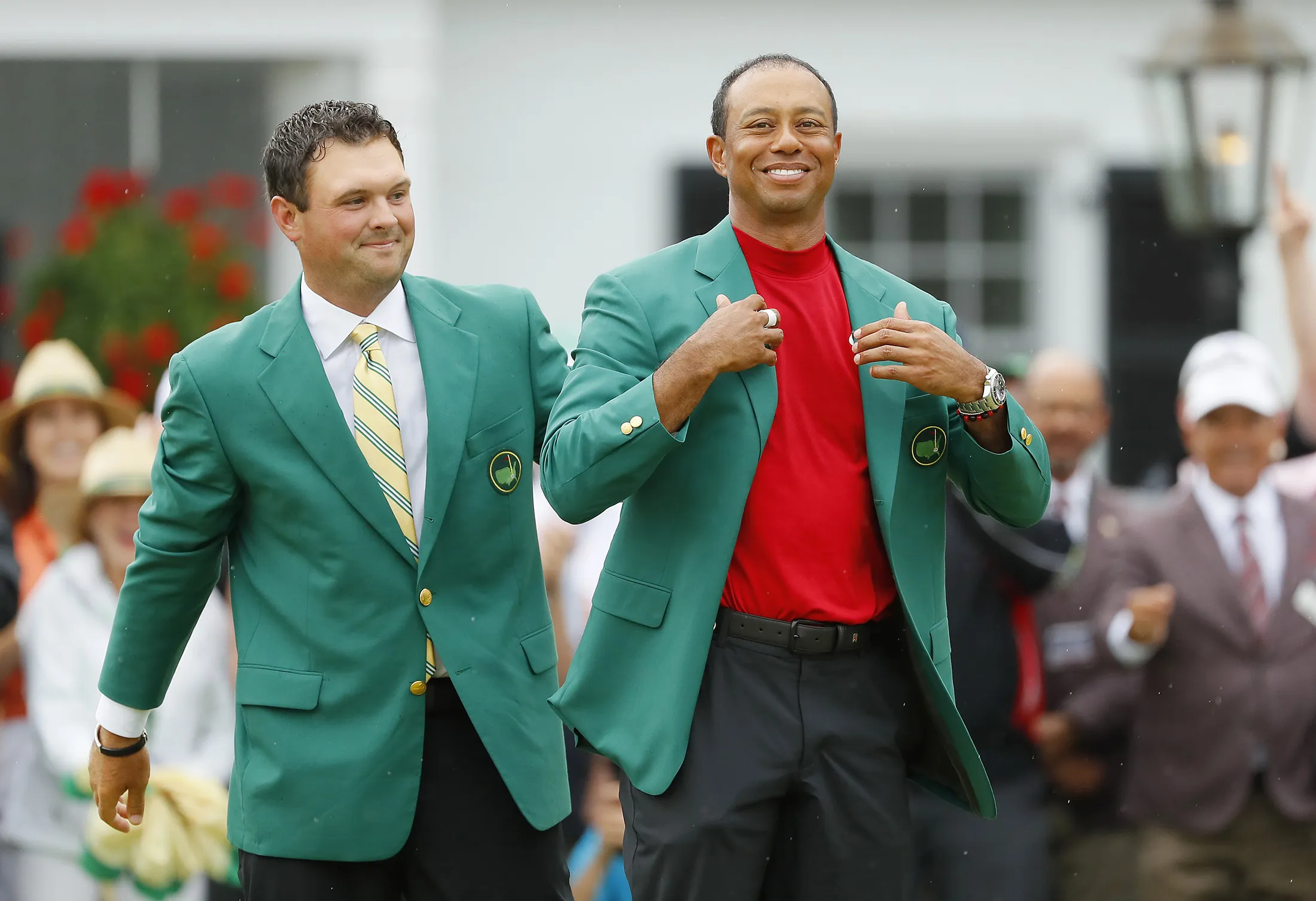 Tiger Woods is awarded the Green Jacket during the ceremony after winning the Masters at Augusta National Golf Club on April 14, 2019.