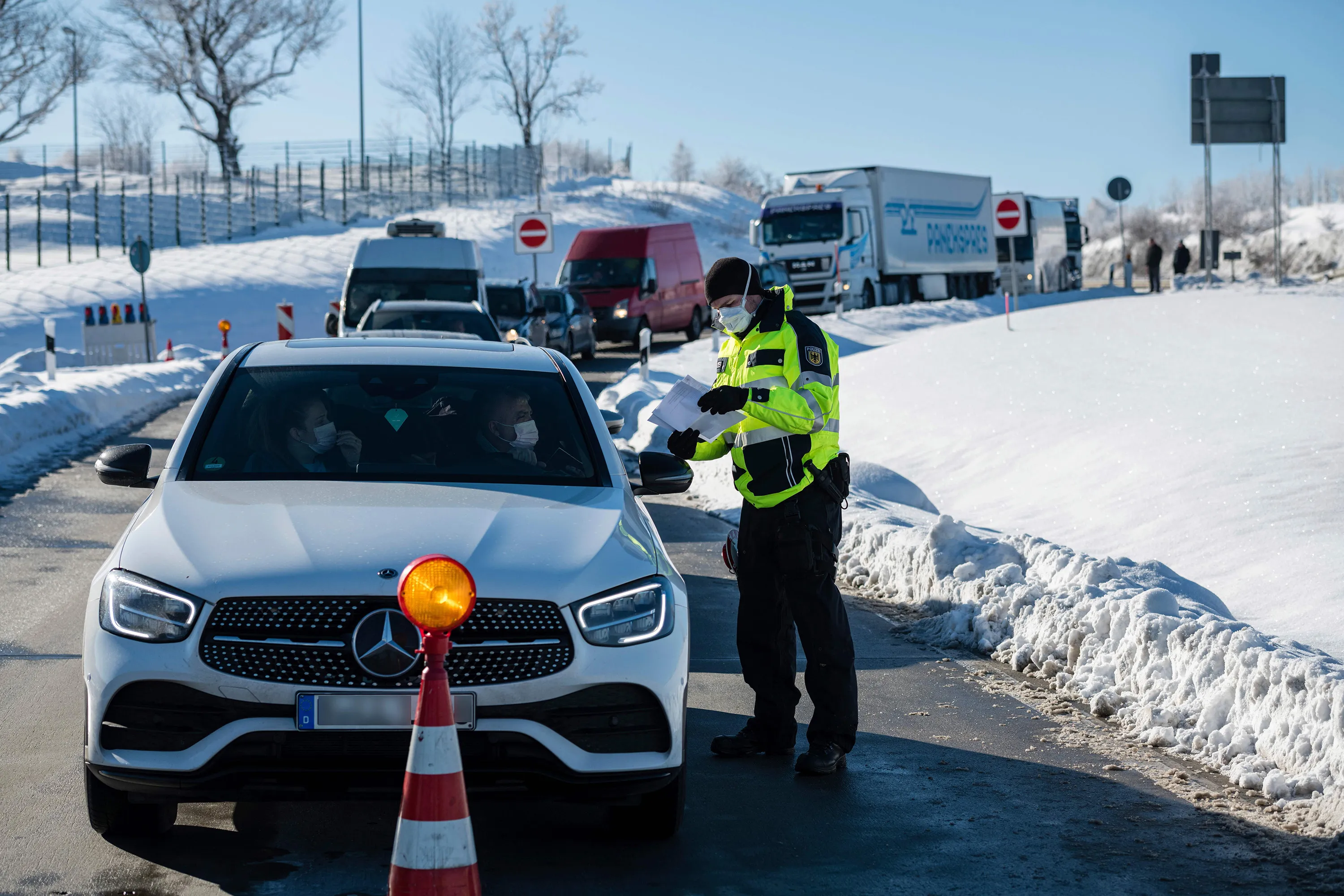 A police&nbsp;officer of checks papers at the German-Czech border near Breitenau,&nbsp;Germany, on Feb. 14.