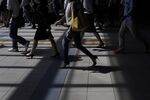 Morning commuters make their way to work in Tokyo, Japan.