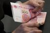 New Chinese 100-Yuan Banknotes As New Design Goes Into Circulation