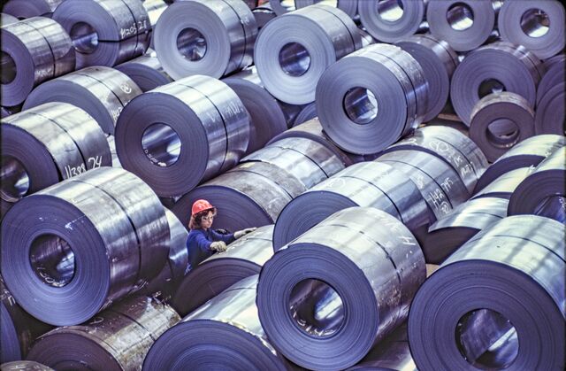 A worker examines rolls of finished steel at the Bethlehem Steel mill outside Baltimore in 1989.