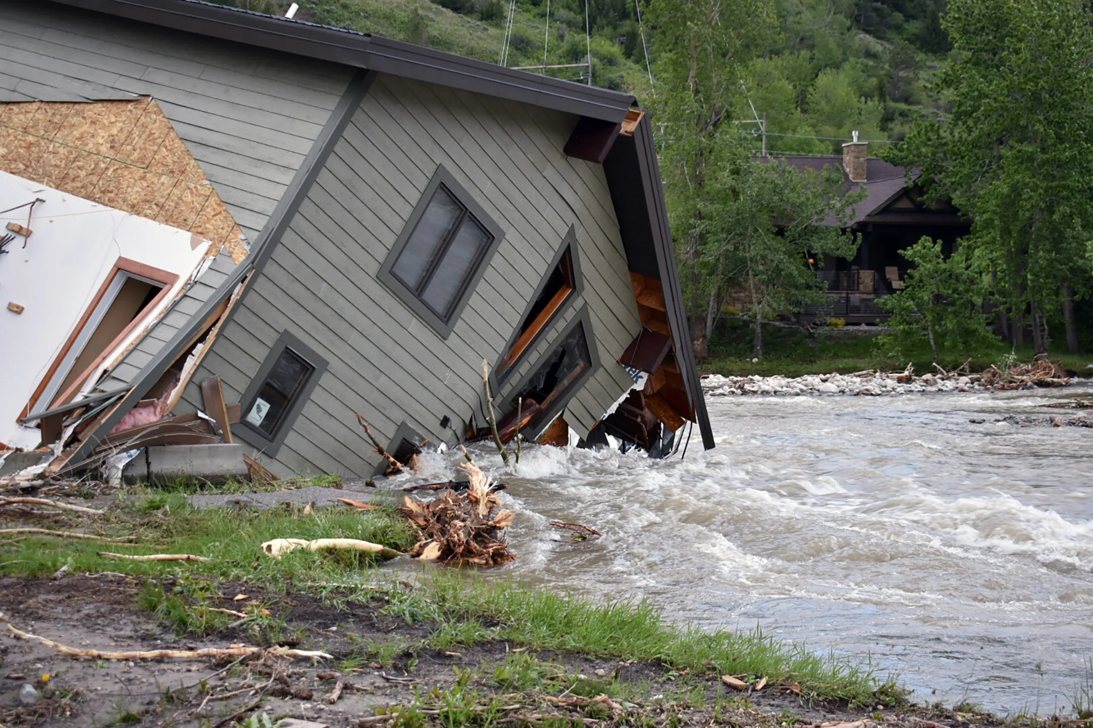 A house that was pulled into Rock Creek by floodwaters in Red Lodge, Montana,&nbsp;on June 14.