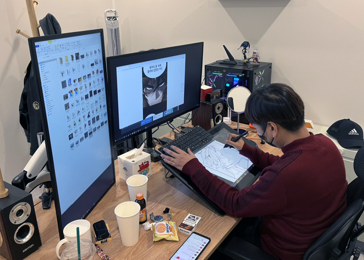 An illustrator works on a “webtoon” project in Kenaz’s office in Seoul.