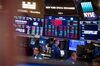 Traders work on the floor of the New York Stock Exchange (NYSE) in New York, U.S.