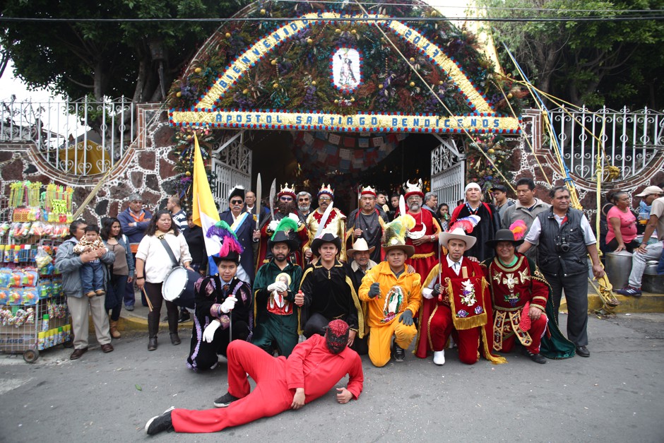 Los Santiagueros, a traditional band of performers, pose during the celebration of Santiago Apostol in the church of Acahualtepec.