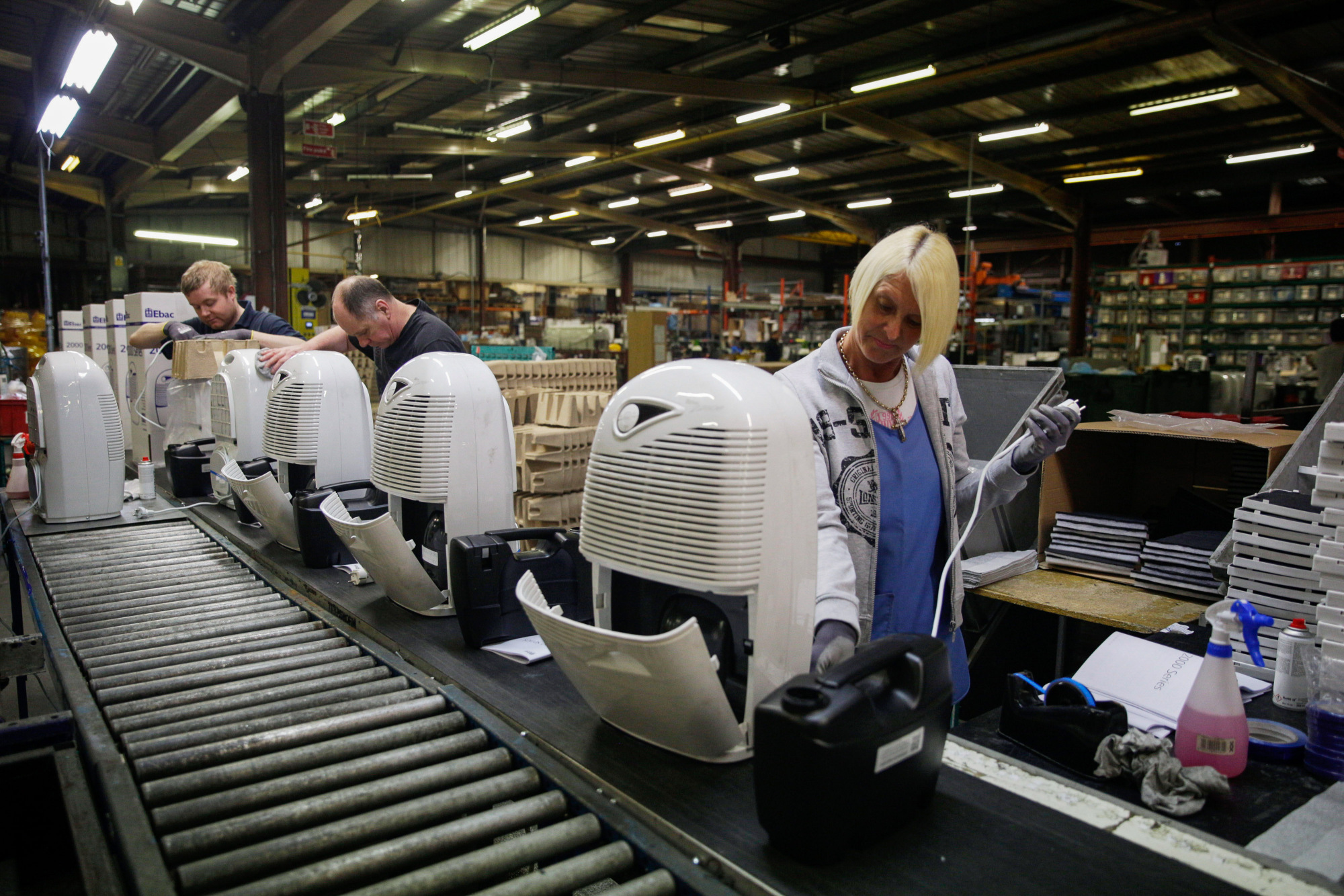 Employees assemble dehumidifiers on the production line at the Ebac Ltd. factory in Newton Aycliffe, U.K.