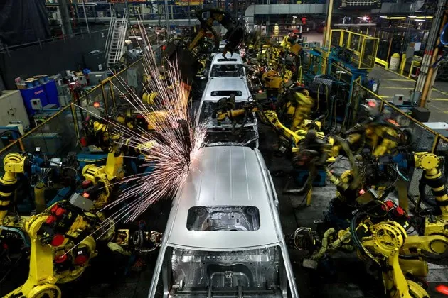 Robots weld the frames of Odyssey minivans on an assembly line at Honda’s facility in Lincoln, Ala.