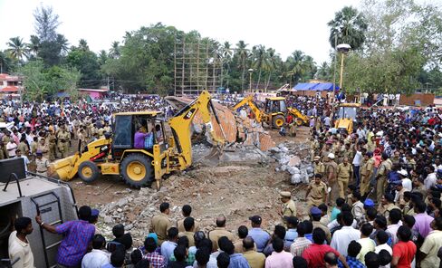 Officials and bystanders gather at the temple on April 10.