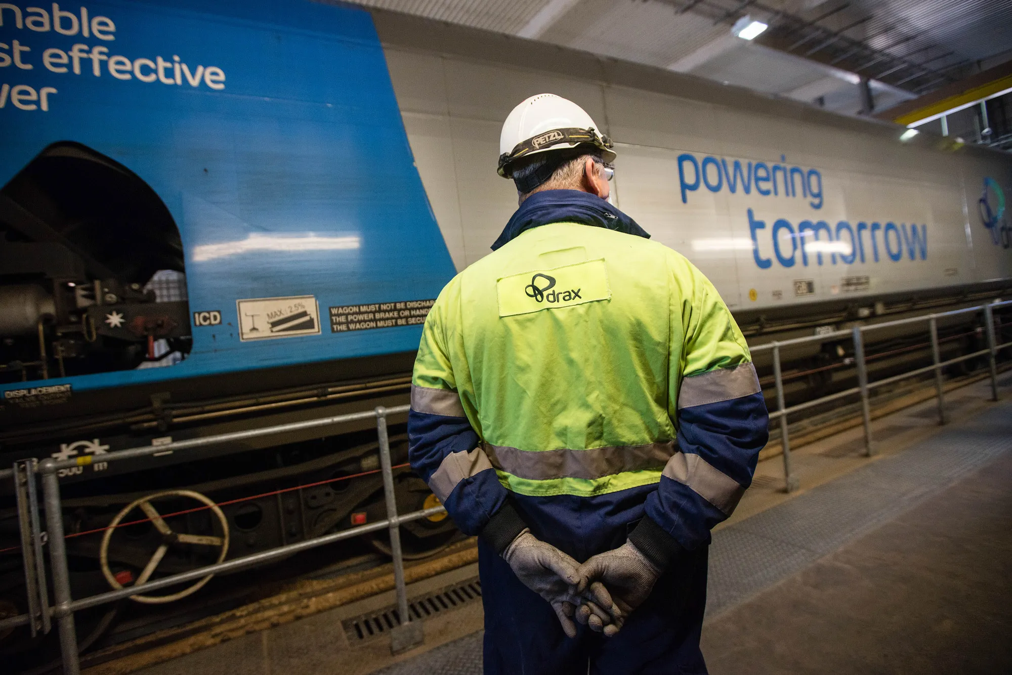 A train containing wood pellets&nbsp;moves through The Drax power station near Selby, UK.
