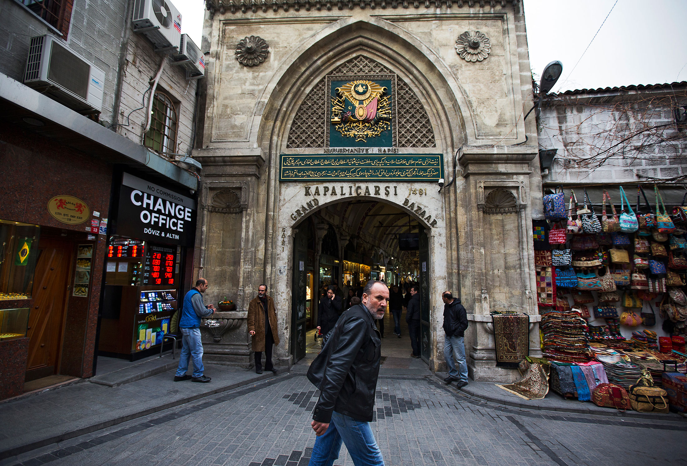A pedestrian passes the entrance to the Grand Bazaar shopping district of Istanbul.
