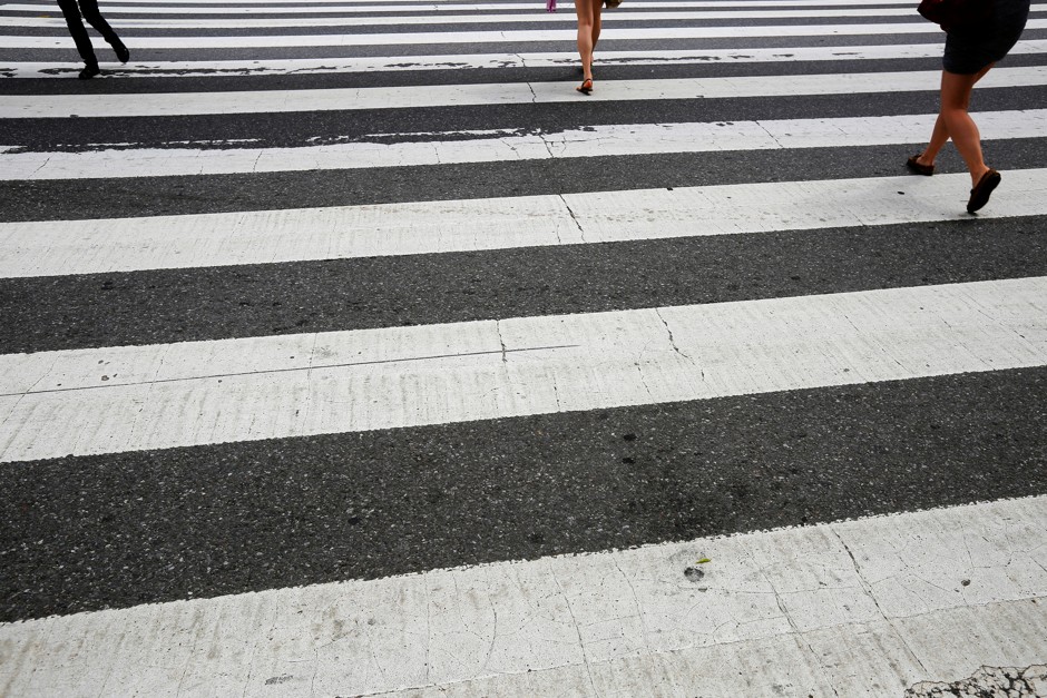 Pedestrians in a crosswalk in Cambridge, Massachusetts.
