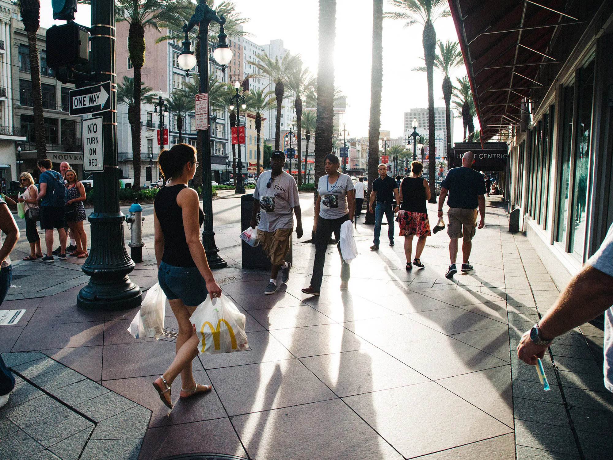 Shoppers and pedestrians walk along Canal Street in New Orleans.