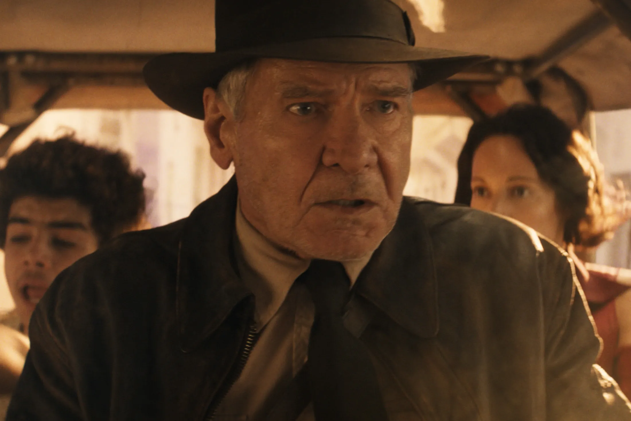 Indy (Harrison Ford) races through the narrow alleys of Tangier with&nbsp;Teddy (Ethann Isidore) and Helena (Phoebe Waller-Bridge)&nbsp;in Indiana Jones and the Dial of Destiny.&nbsp;