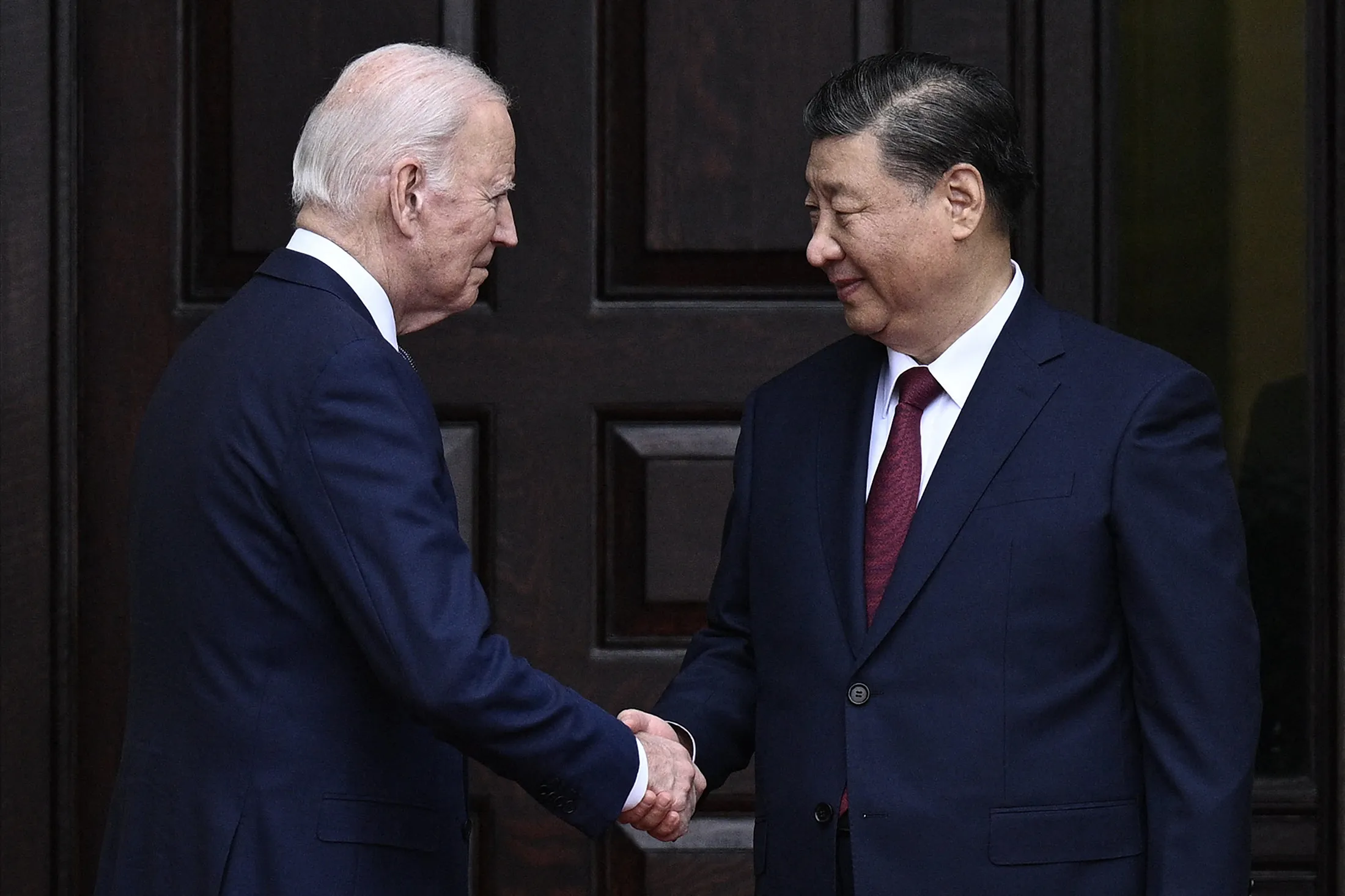 Joe Biden greets Xi Jinping before a meeting in Woodside, California, on Nov. 15.