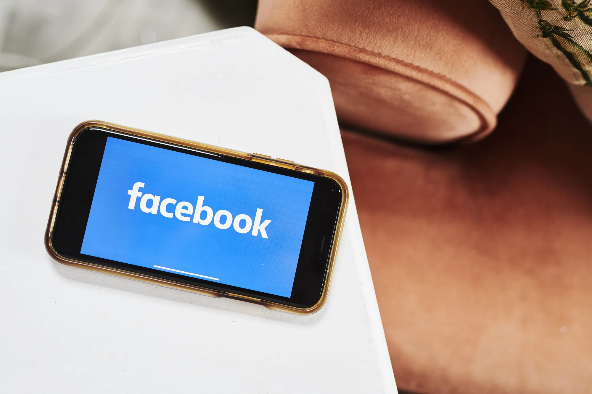Facebook logo on a smartphone.