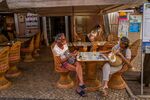 Tourists at an outdoor table of a restaurant in Lagos, Portugal, on May 30.