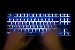A man typing on a back lit computer keyboard. Photographer: Bloomberg Creative Photos/Bloomberg Creative Collection